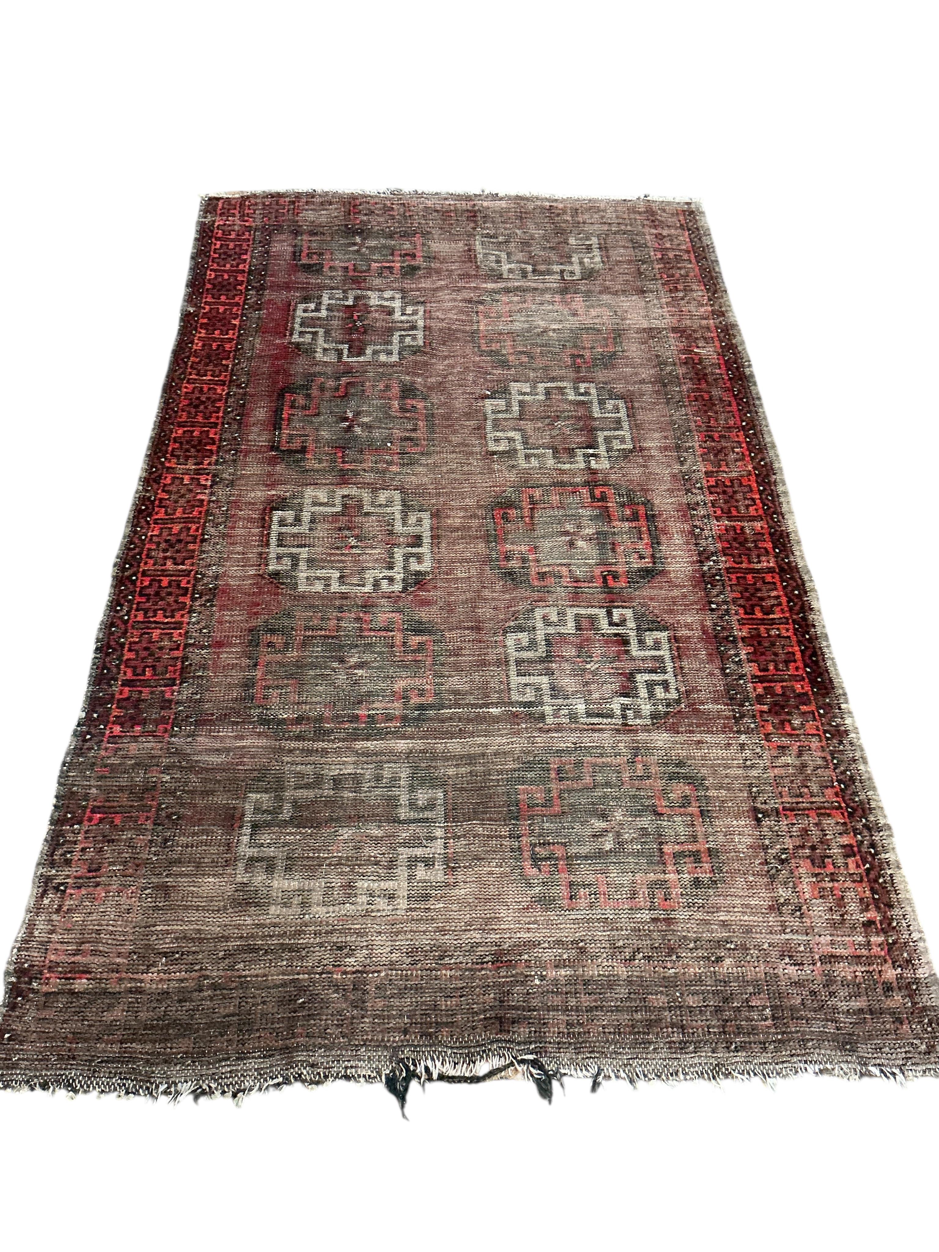 An Afghan red ground runner, 300 x 82cm and a rug, (worn)